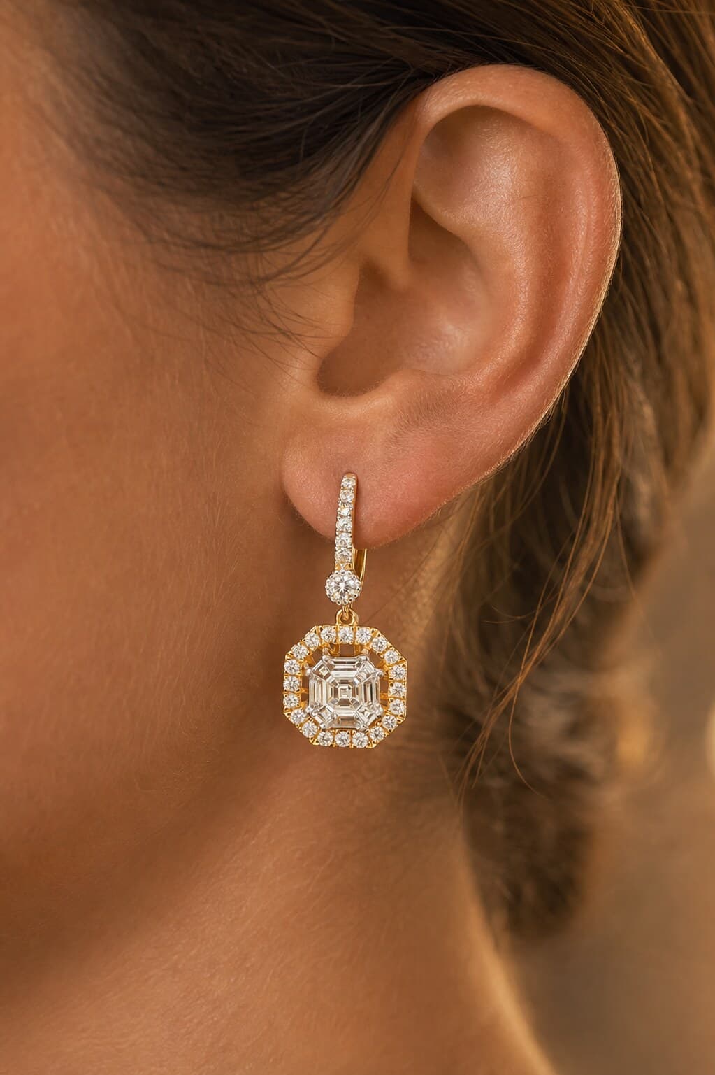 Model wearing a Natural PIECUT asscher-cut drop earring in warm daylight